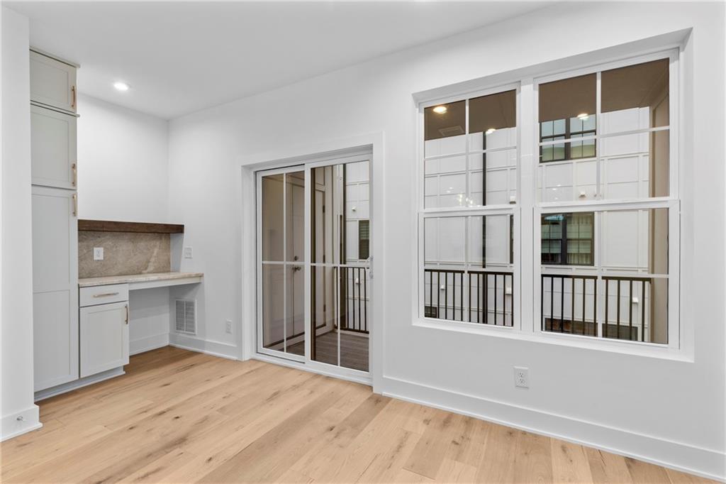 201 New Street, Unit 1204 Decatur, GA 30030 - Photo 10 of 28 a view of a hallway with a kitchen