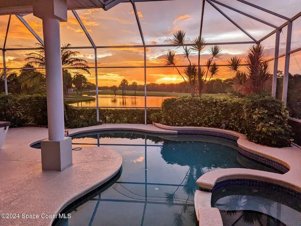 a view of a house with potted plants