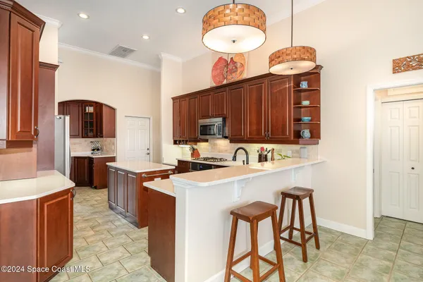 a bathroom with a double vanity sink a mirror and a shower