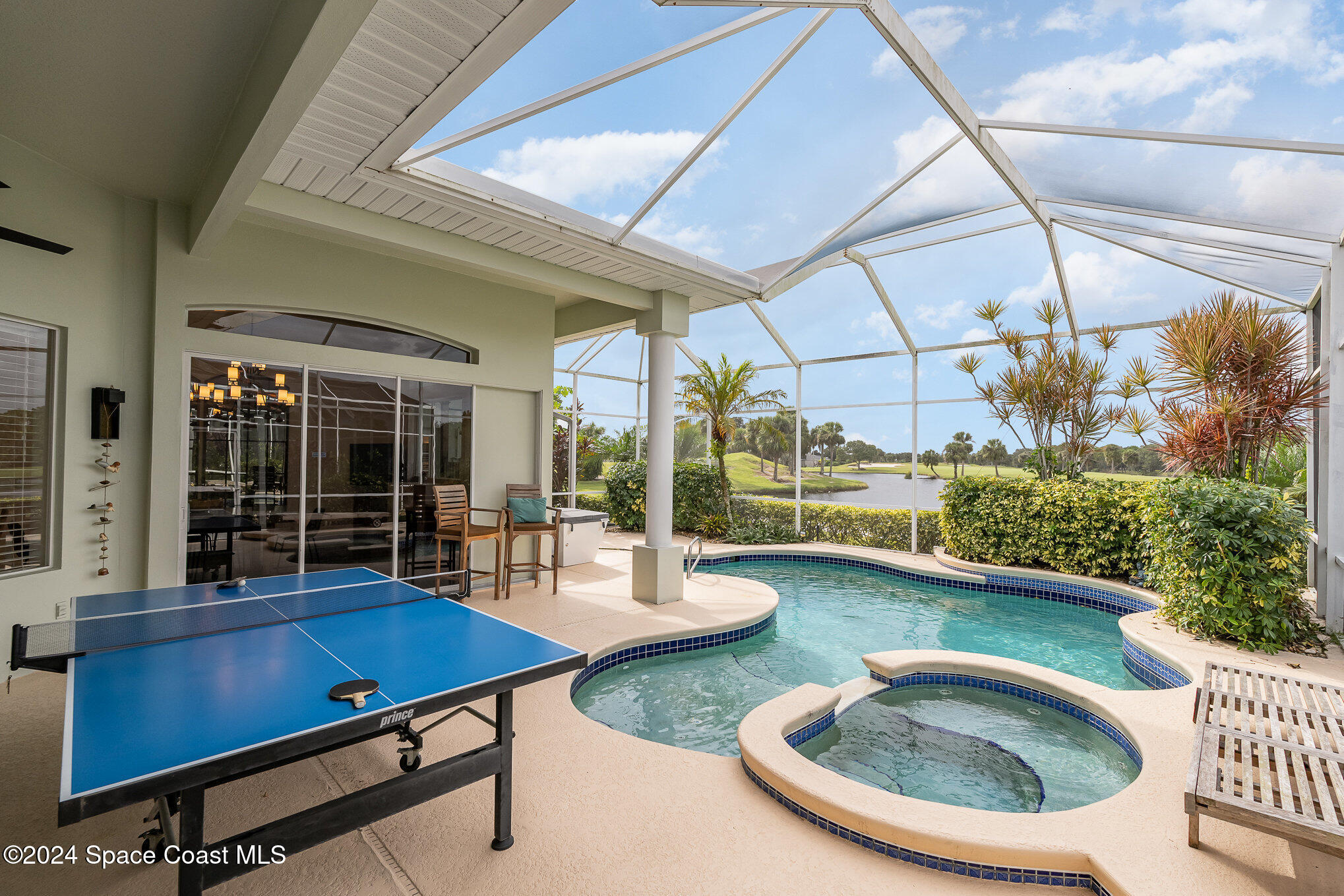 4321 Collingtree Drive Rockledge, FL 32955 - Photo 15 of 70 a view of a patio with dining table and chairs