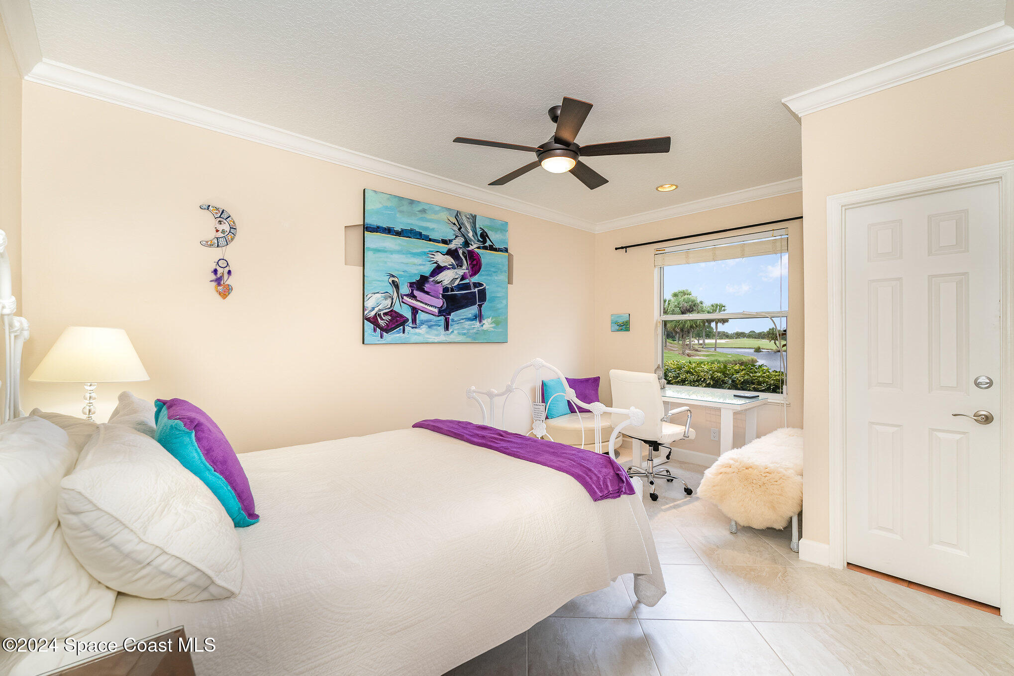 4321 Collingtree Drive Rockledge, FL 32955 - Photo 25 of 70 a bedroom with a bed and a painting on the wall