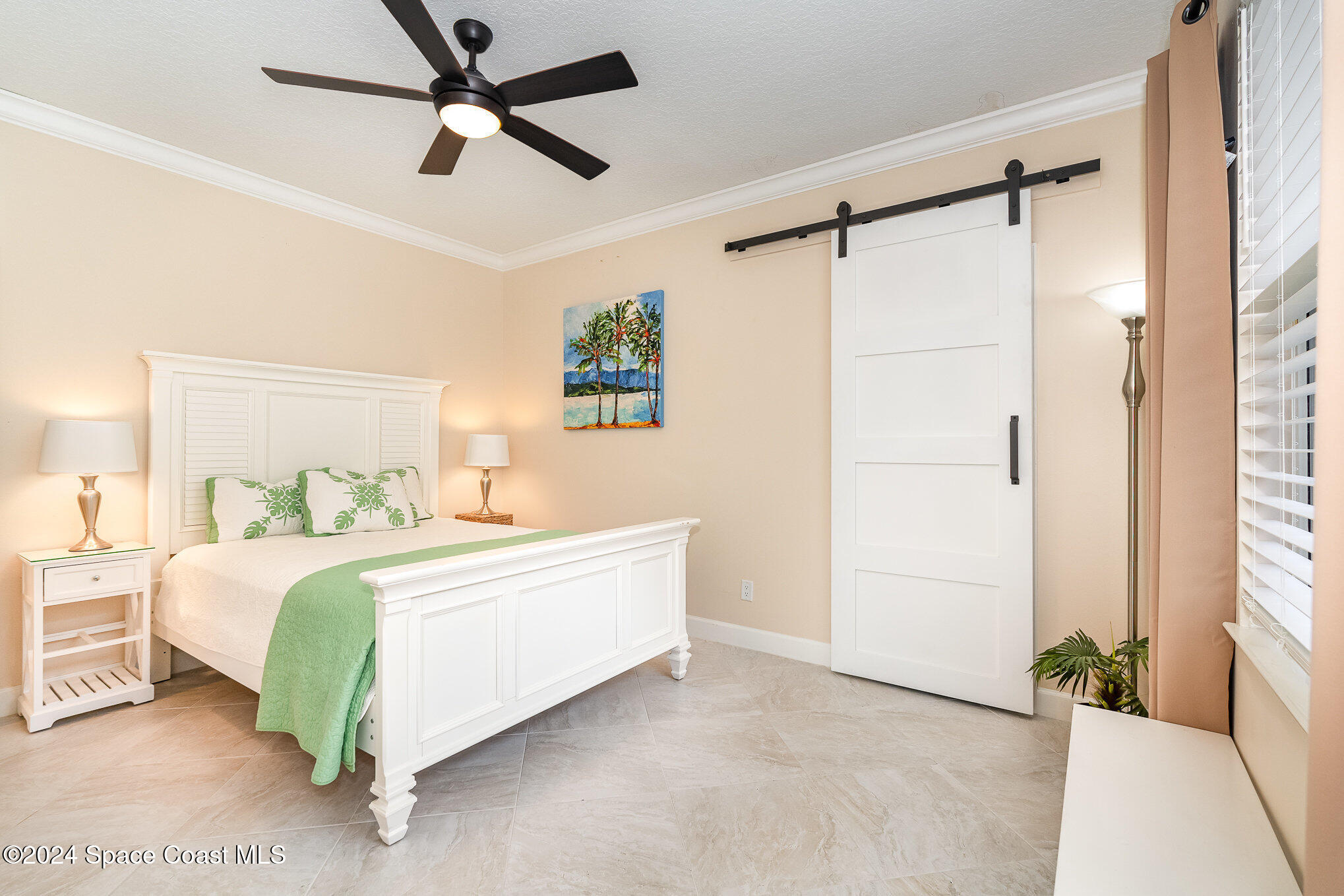 4321 Collingtree Drive Rockledge, FL 32955 - Photo 26 of 70 a bed room with a bed and a ceiling fan
