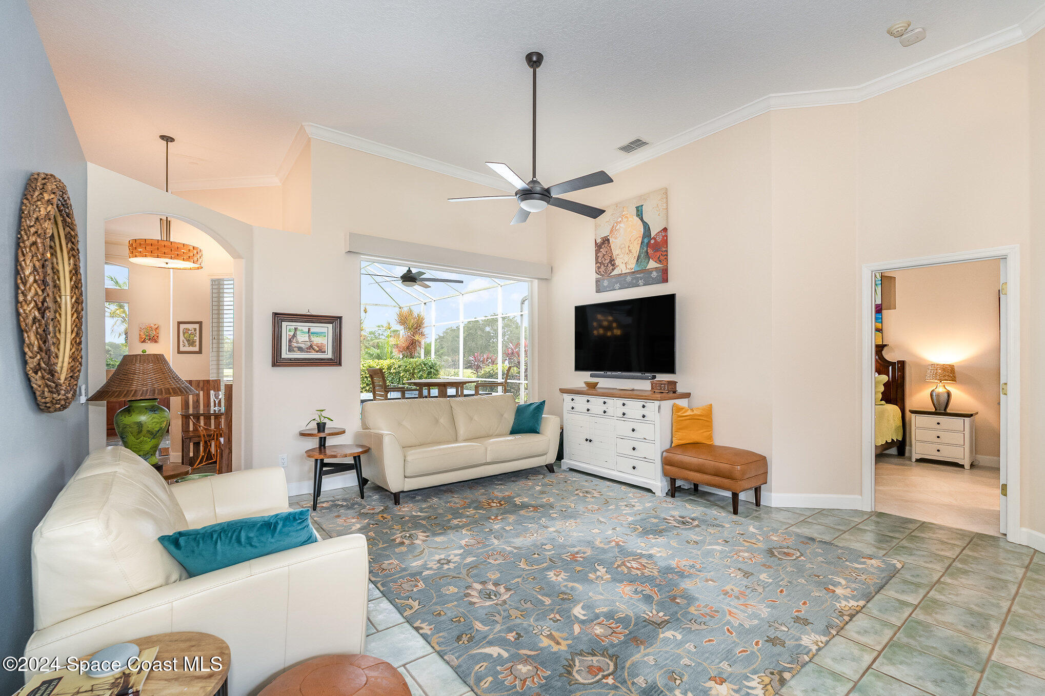 4321 Collingtree Drive Rockledge, FL 32955 - Photo 28 of 70 a living room with furniture and a flat screen tv