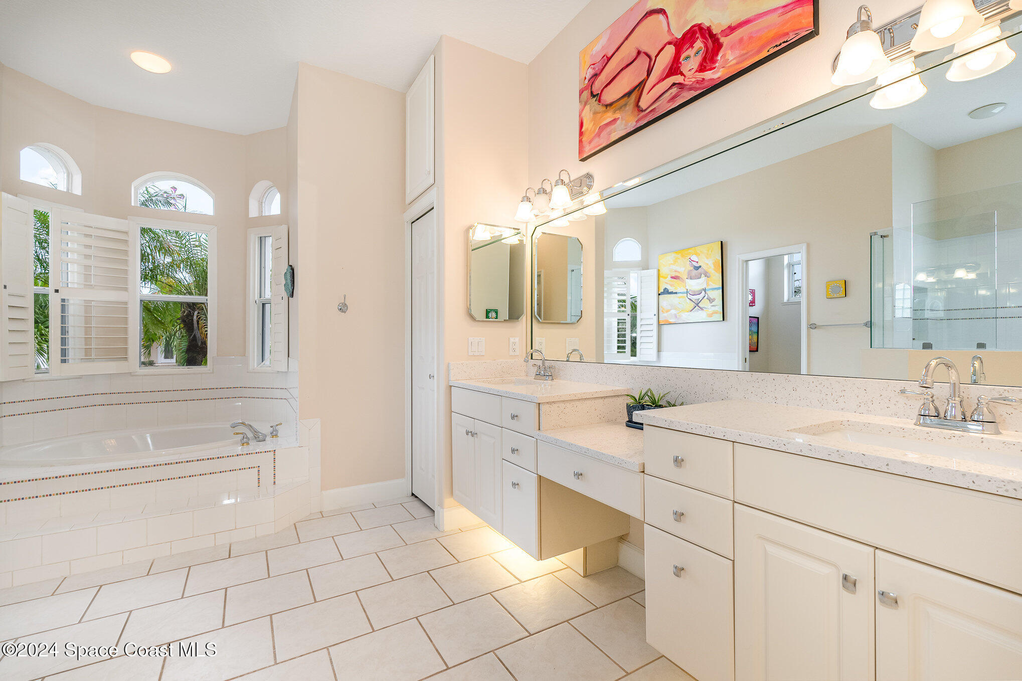 4321 Collingtree Drive Rockledge, FL 32955 - Photo 29 of 70 a spacious bathroom with a sink mirror and vanity