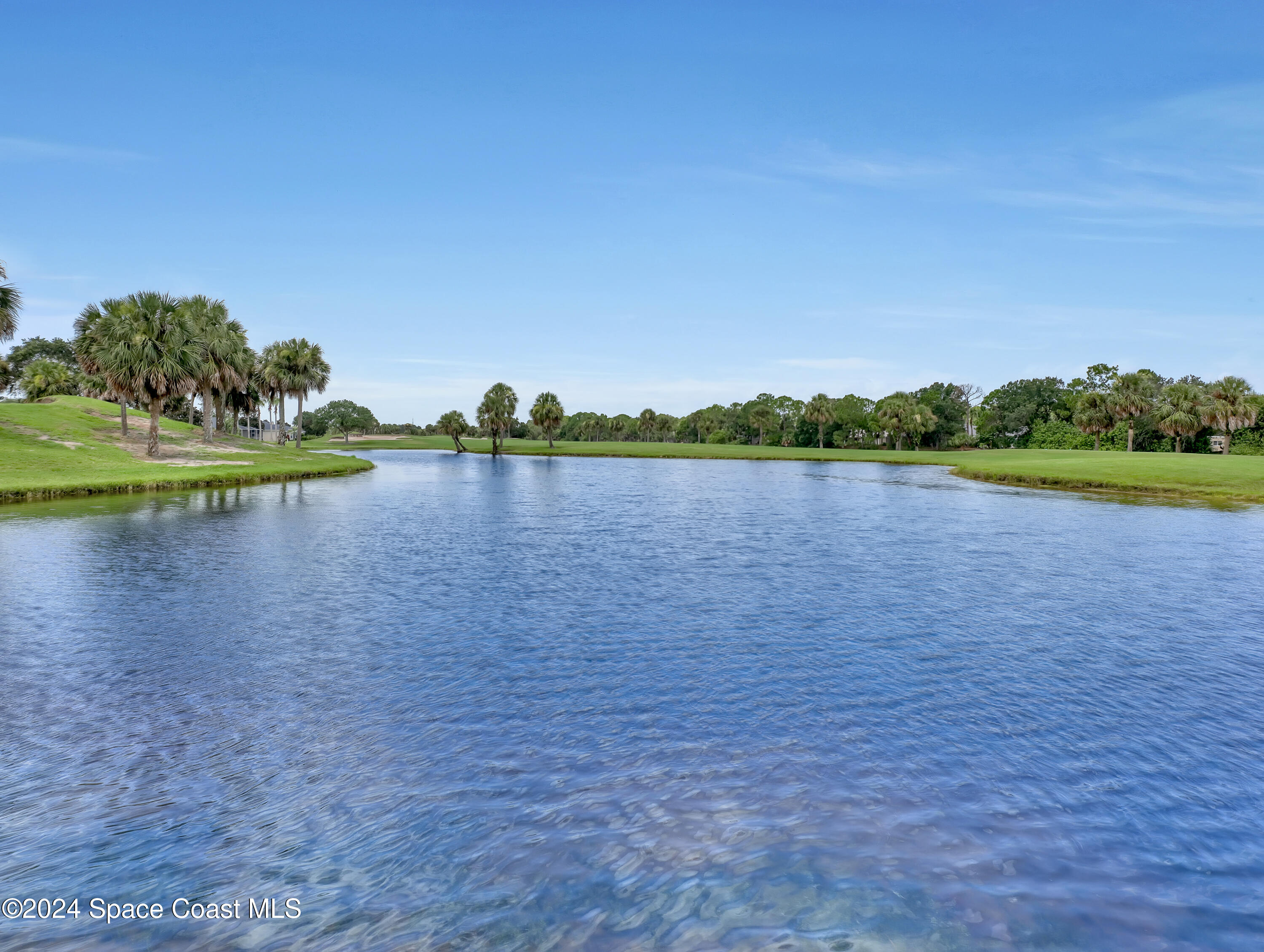 4321 Collingtree Drive Rockledge, FL 32955 - Photo 40 of 70 a view of a lake with houses in the back
