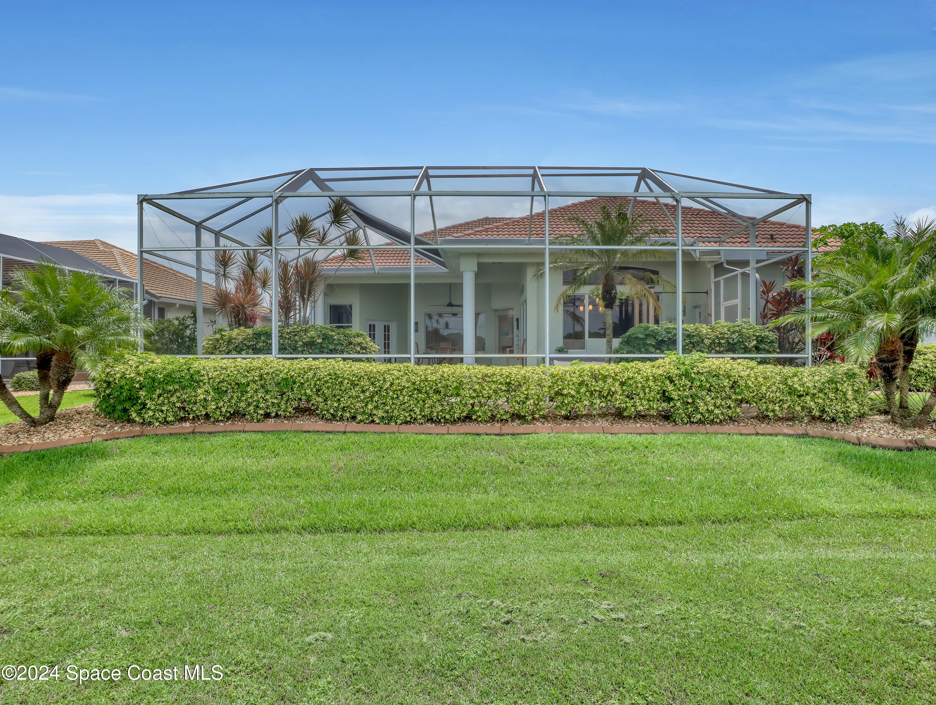 4321 Collingtree Drive Rockledge, FL 32955 - Photo 43 of 70 a front view of a house with a yard