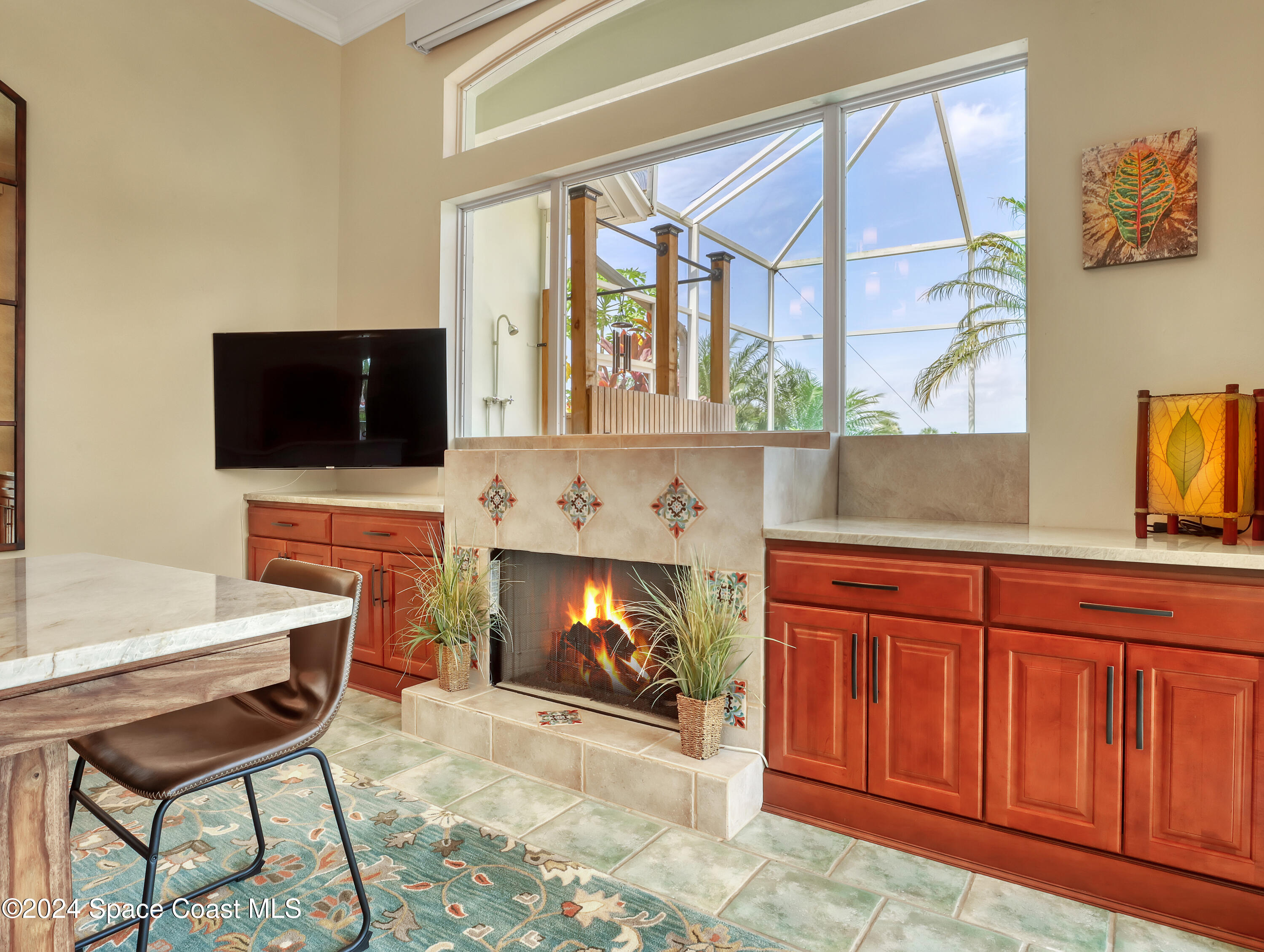 4321 Collingtree Drive Rockledge, FL 32955 - Photo 57 of 70 a living room with fireplace furniture and a flat screen tv