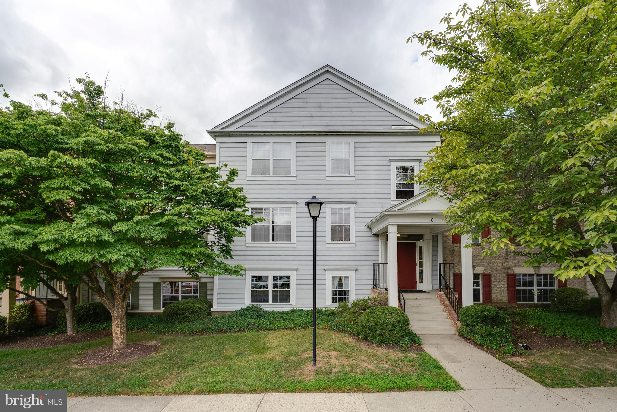 6 Normandy Square Court, Unit 2CB Silver Spring, MD 20906 - Photo 1 of 28 a front view of a house with a yard