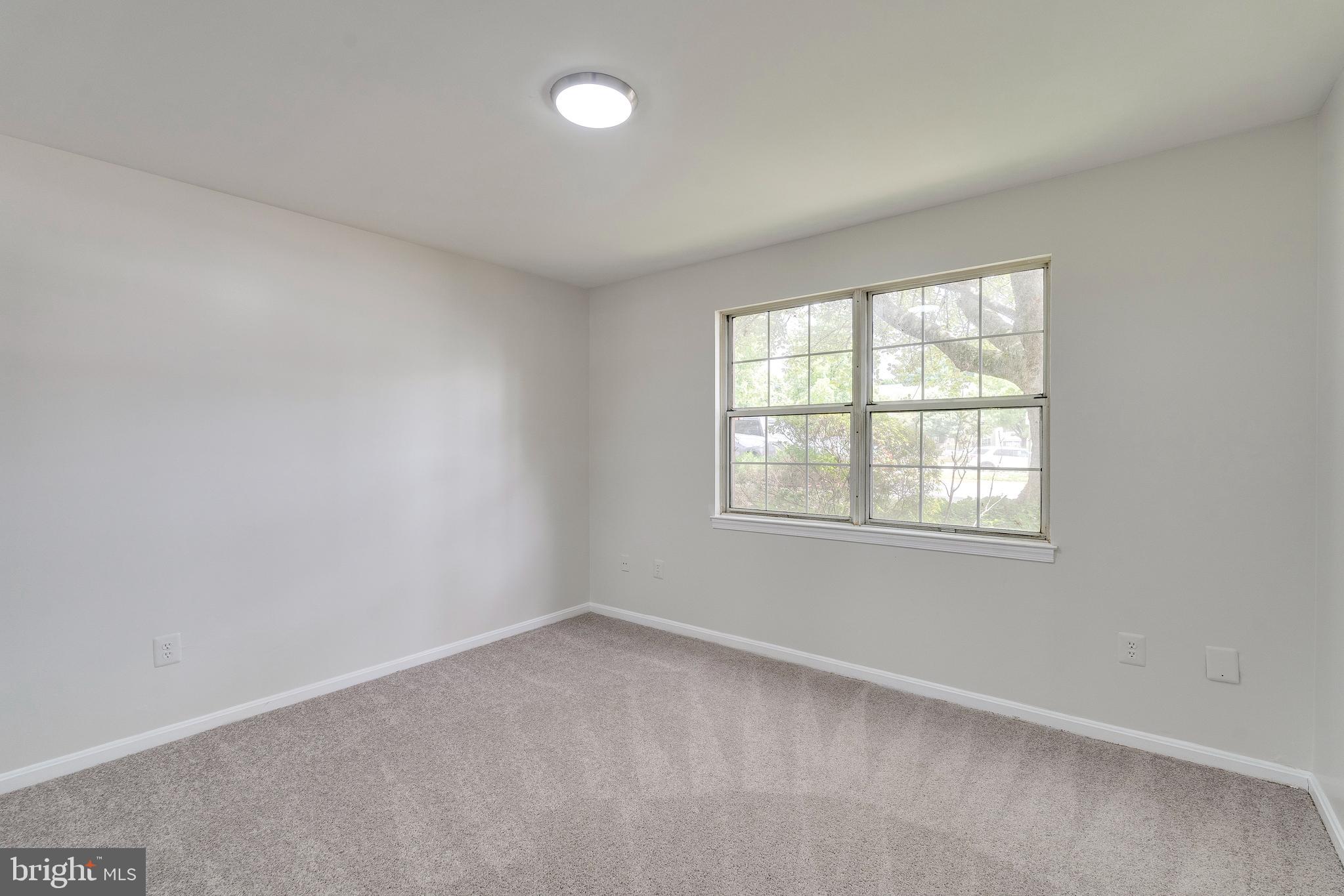 6 Normandy Square Court, Unit 2CB Silver Spring, MD 20906 - Photo 12 of 28 an empty room with a window