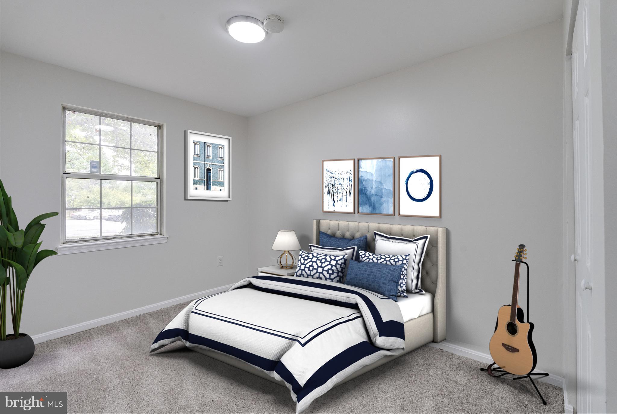 6 Normandy Square Court, Unit 2CB Silver Spring, MD 20906 - Photo 16 of 28 a bedroom with a bed and a window