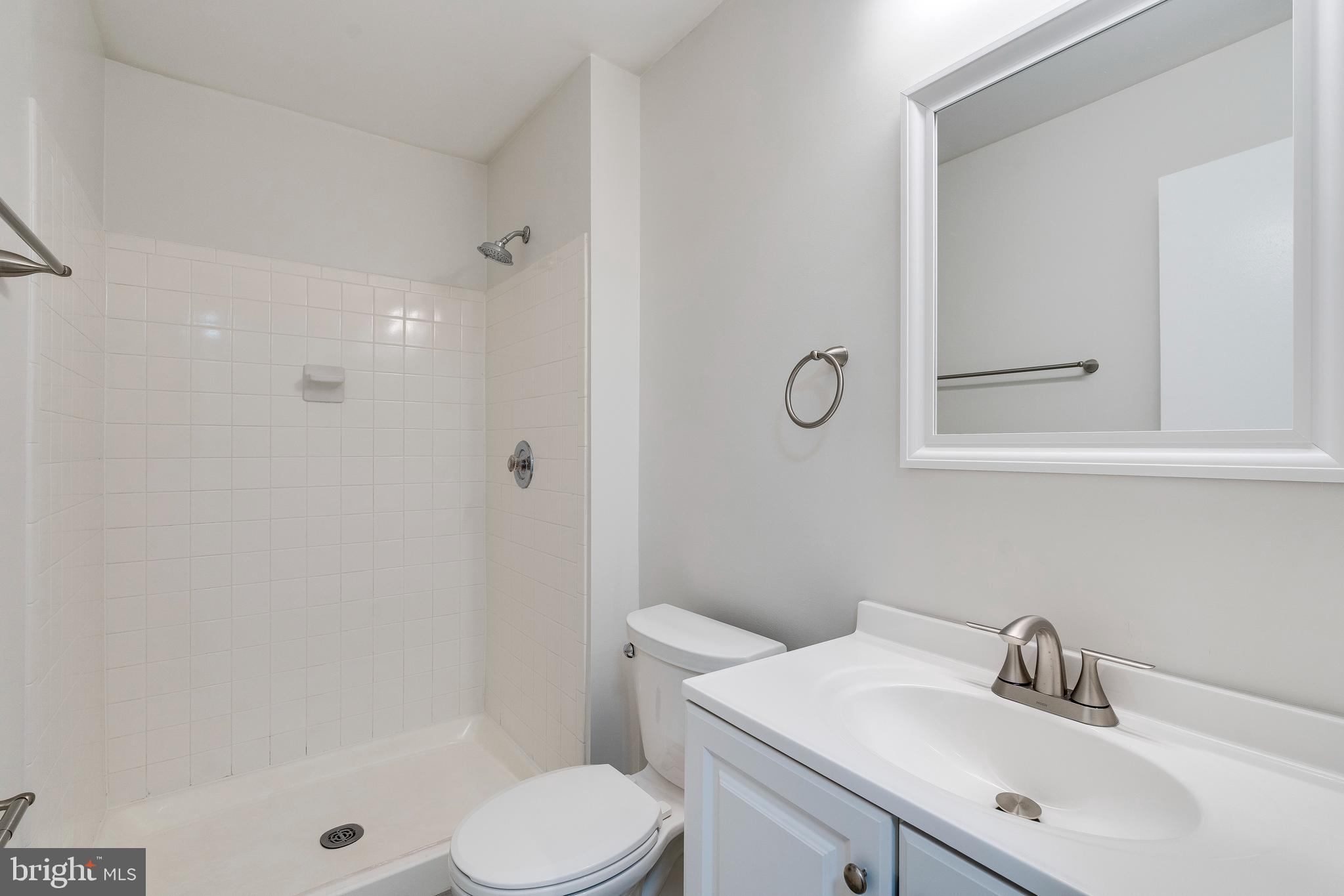 6 Normandy Square Court, Unit 2CB Silver Spring, MD 20906 - Photo 18 of 28 a bathroom with a sink toilet and shower