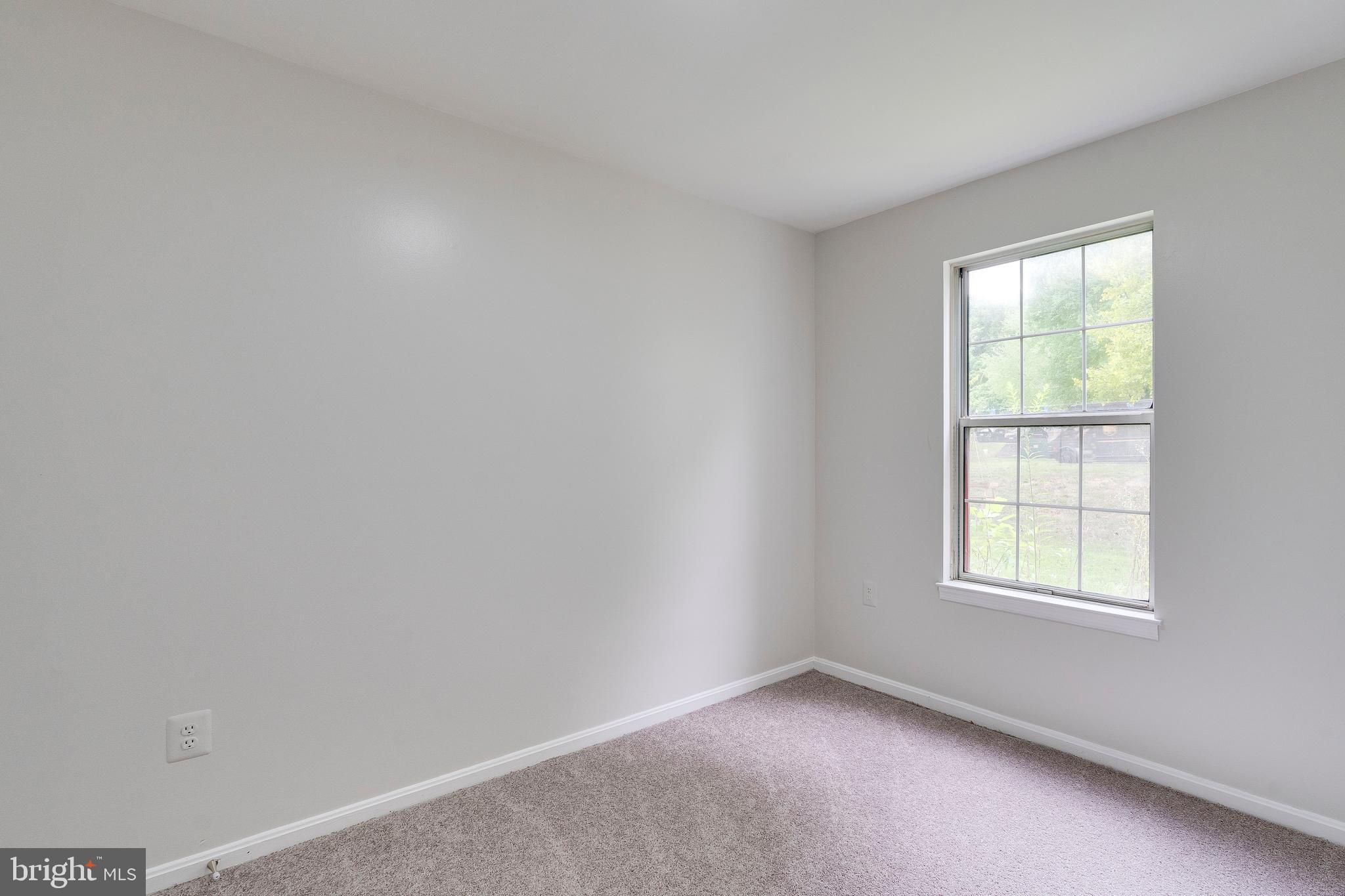 6 Normandy Square Court, Unit 2CB Silver Spring, MD 20906 - Photo 19 of 28 an empty room with a window
