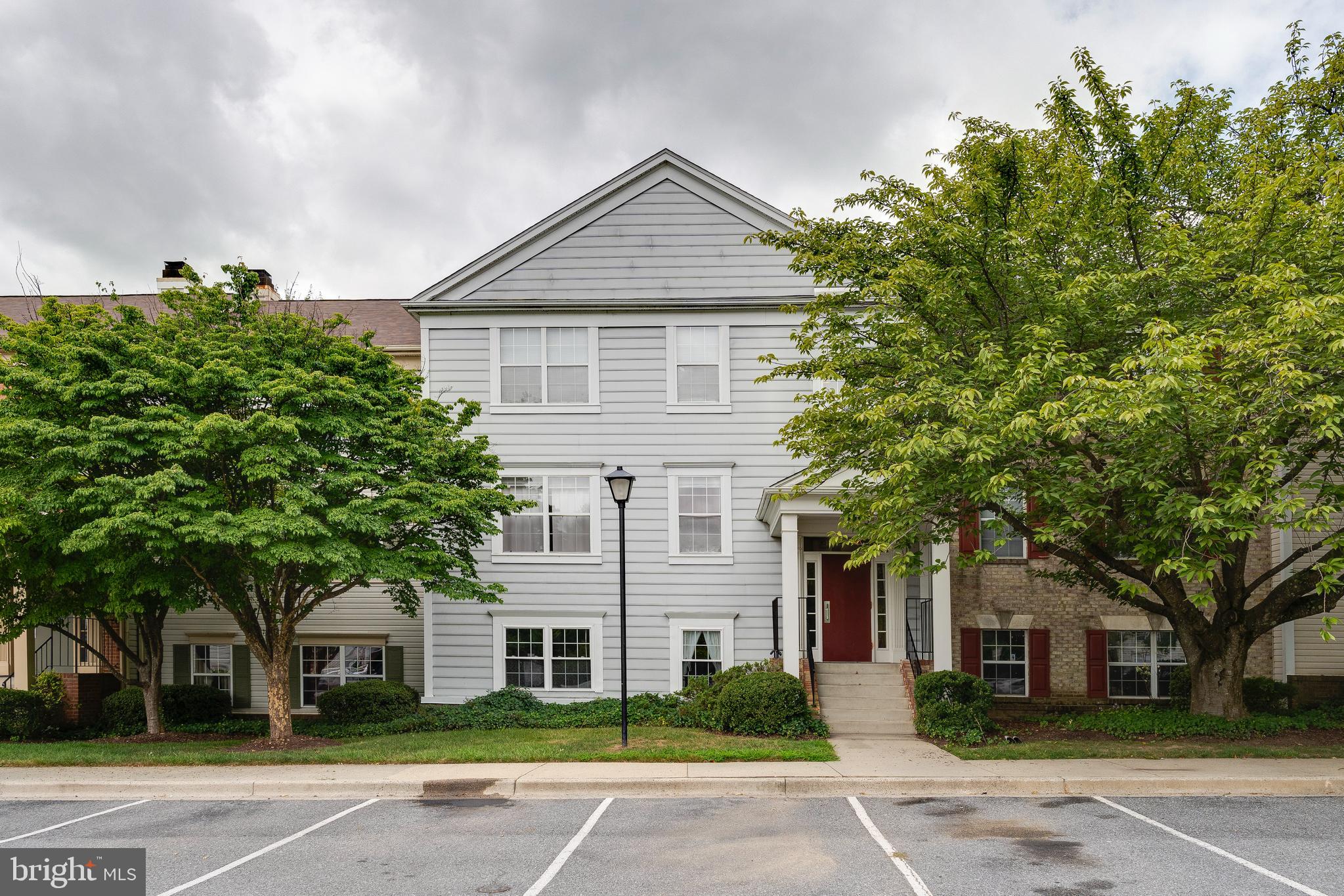 6 Normandy Square Court, Unit 2CB Silver Spring, MD 20906 - Photo 21 of 28 a front view of a house with a garden