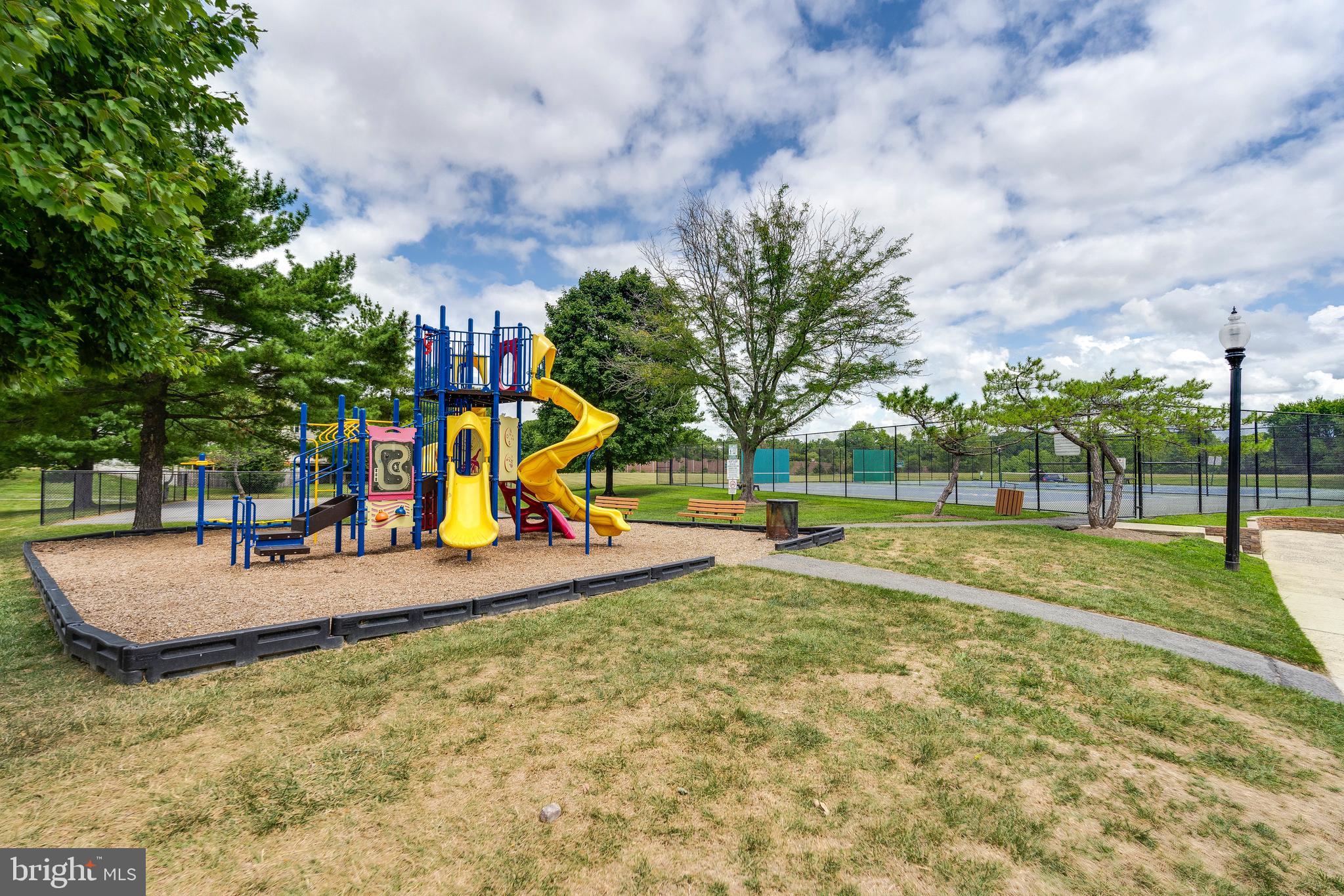6 Normandy Square Court, Unit 2CB Silver Spring, MD 20906 - Photo 25 of 28 a view of a park with swings and slides