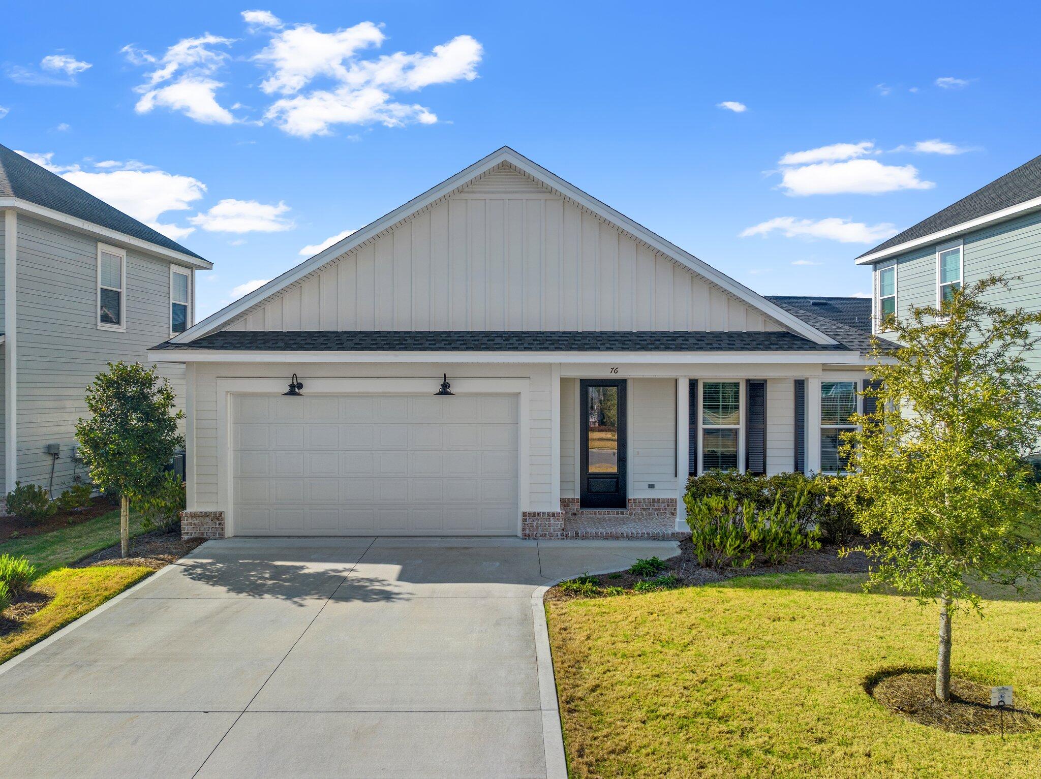 76 Conifer Ct Inlet Beach Inlet Beach, FL 32461 - Photo 1 of 25 a front view of a house with garden