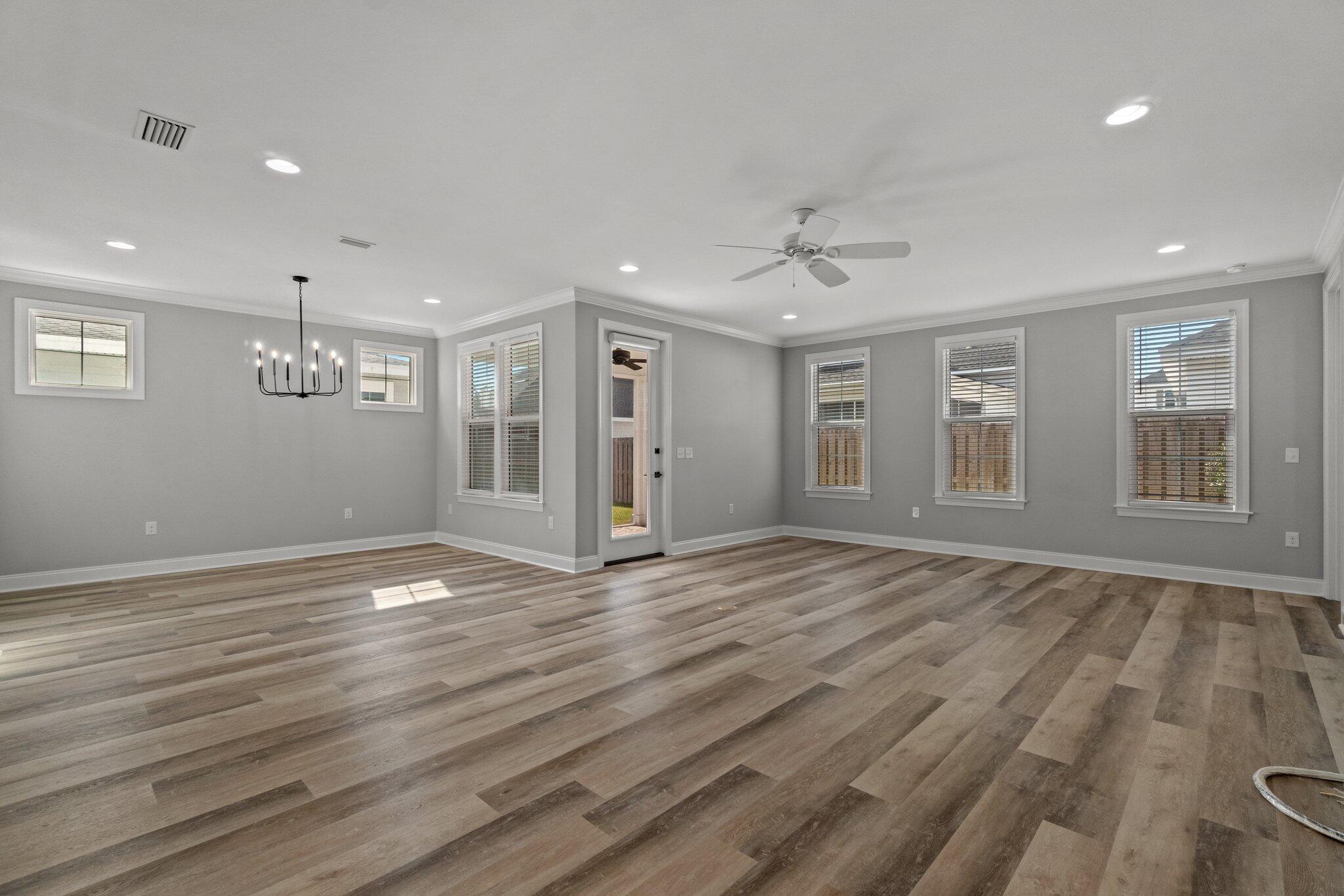 76 Conifer Ct Inlet Beach Inlet Beach, FL 32461 - Photo 6 of 25 a view of an empty room with wooden floor and a window