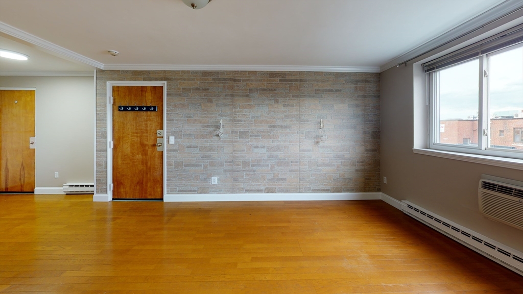 326 Broadway, Unit 21 Somerville, MA 02145 - Photo 3 of 8 a view of a room with window