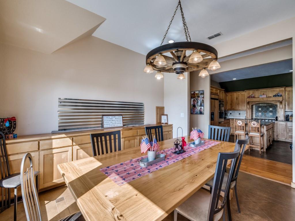 2250 Morrow Road Valley View, TX 76272 - Photo 12 of 35 a view of a dining room with furniture wooden floor and chandelier