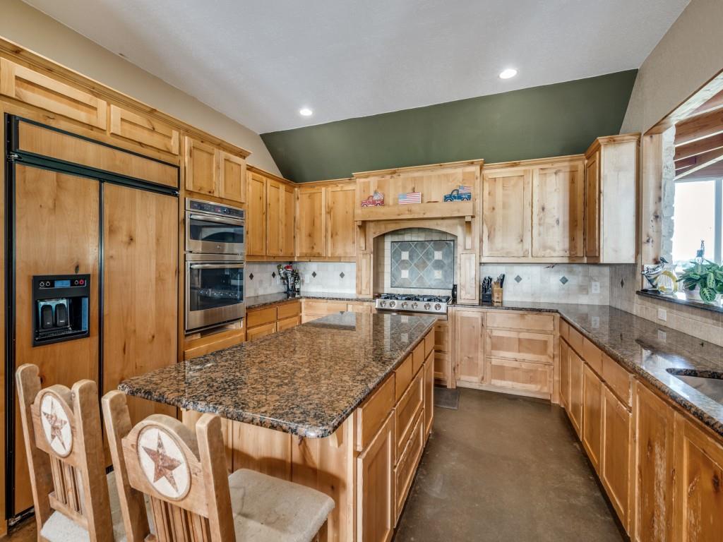 2250 Morrow Road Valley View, TX 76272 - Photo 14 of 35 a kitchen with stainless steel appliances granite countertop a sink a stove counter space and cabinets