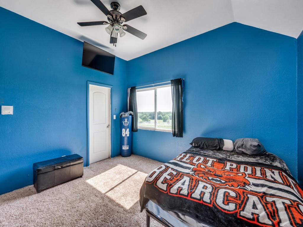 2250 Morrow Road Valley View, TX 76272 - Photo 22 of 35 a bedroom with a bed and a window