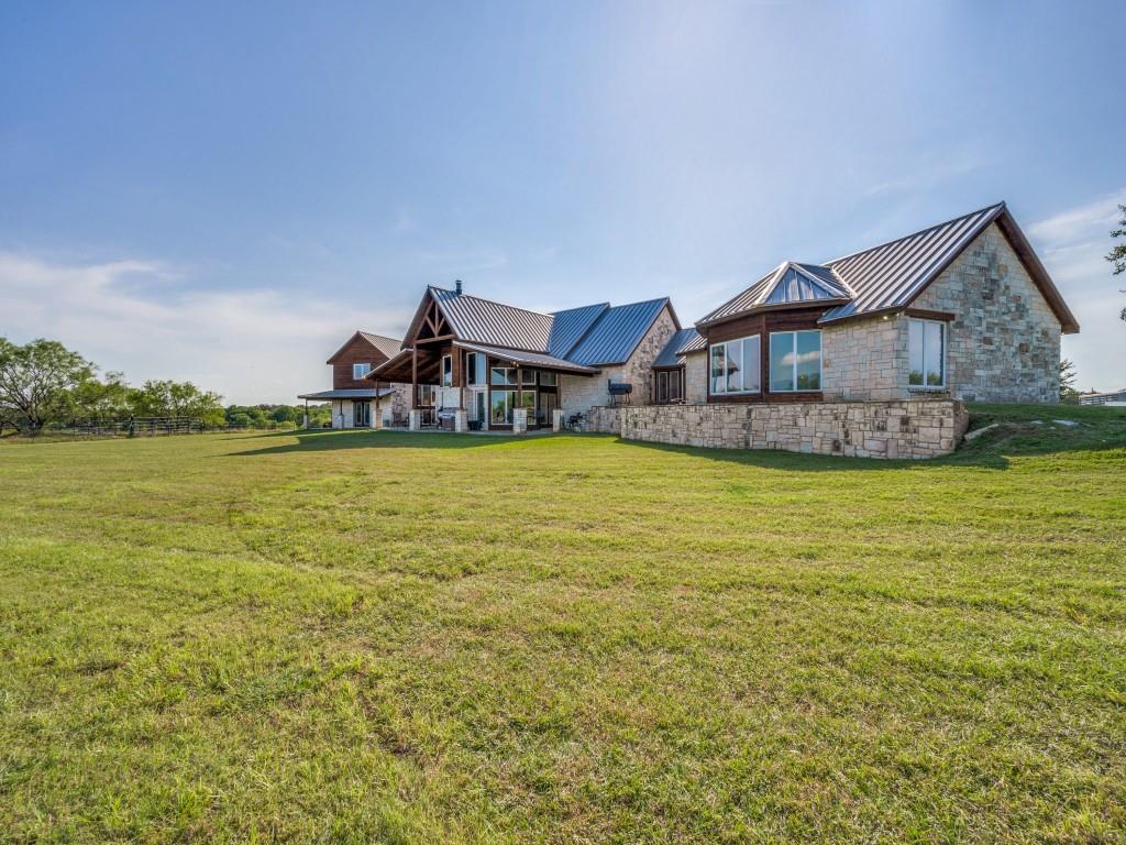 2250 Morrow Road Valley View, TX 76272 - Photo 33 of 35 a view of a house with a yard and sitting area