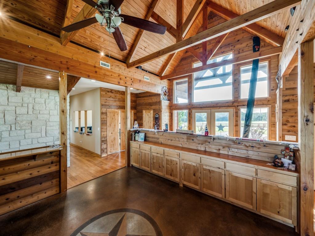 2250 Morrow Road Valley View, TX 76272 - Photo 9 of 35 a large room with lot of wooden furniture and floor to ceiling windows