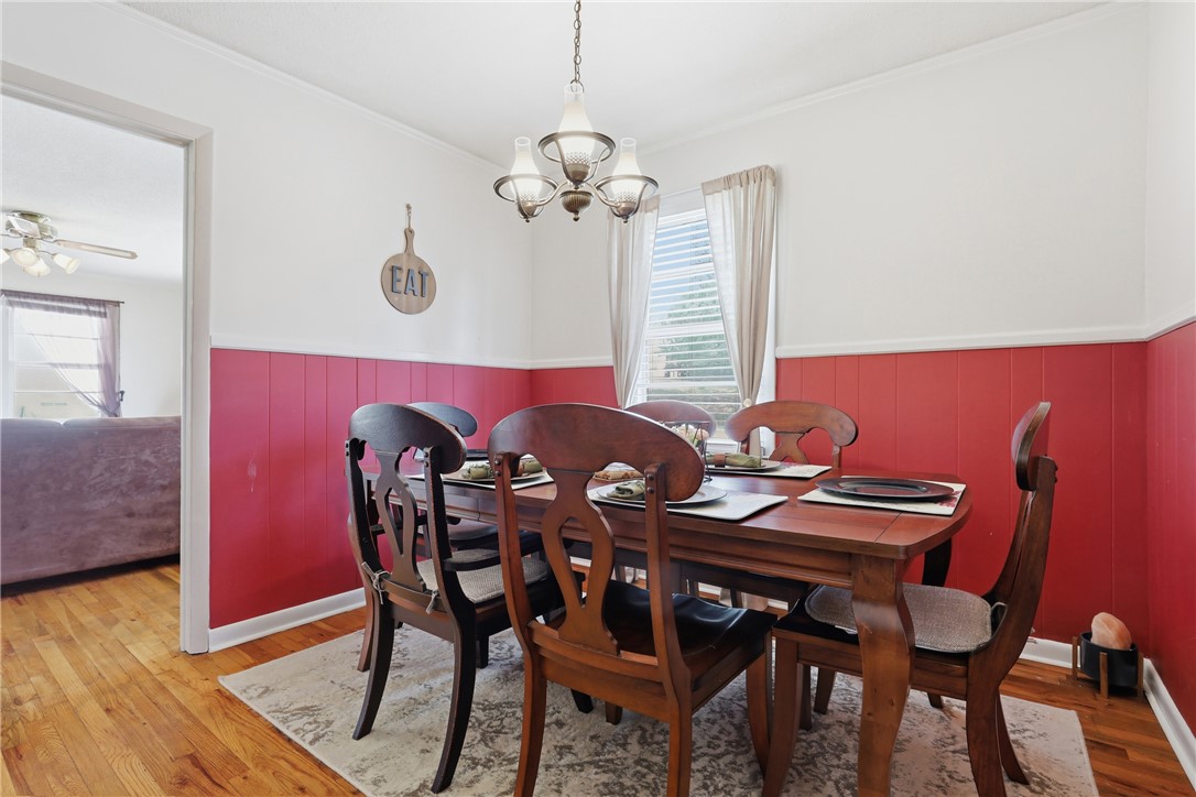 602 South Tugaloo Street Walhalla, SC 29691 - Photo 11 of 39 This dining area features rich wood flooring and a classic lighting fixture.