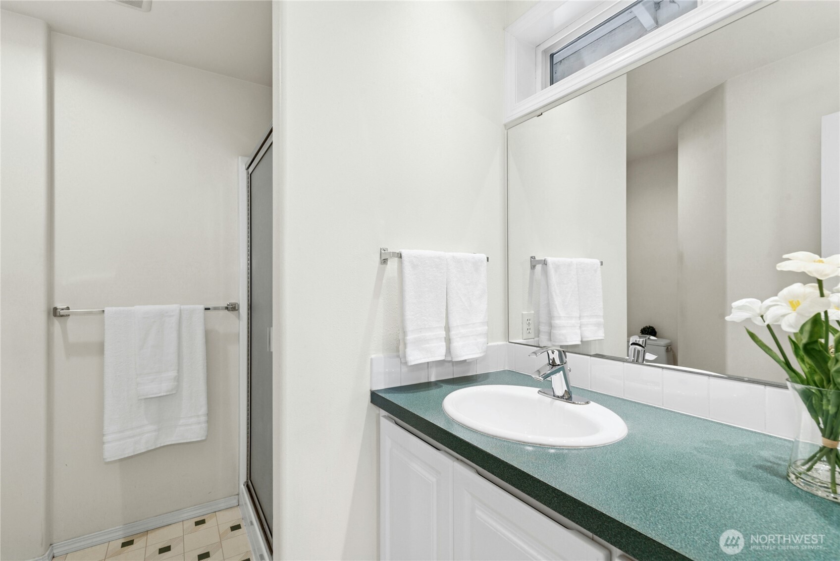 23621 7th Avenue West Bothell, WA 98021 - Photo 15 of 33 a bathroom with a granite countertop sink and a mirror