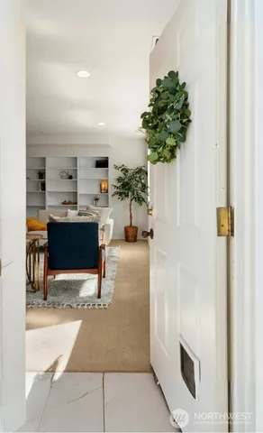 a view of kitchen with furniture and a potted plant