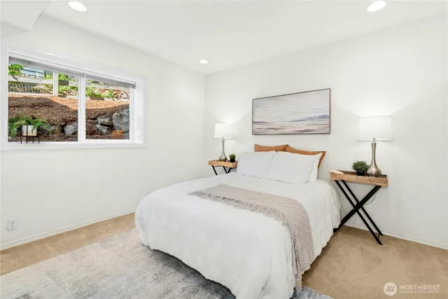 a bedroom with bed and a window