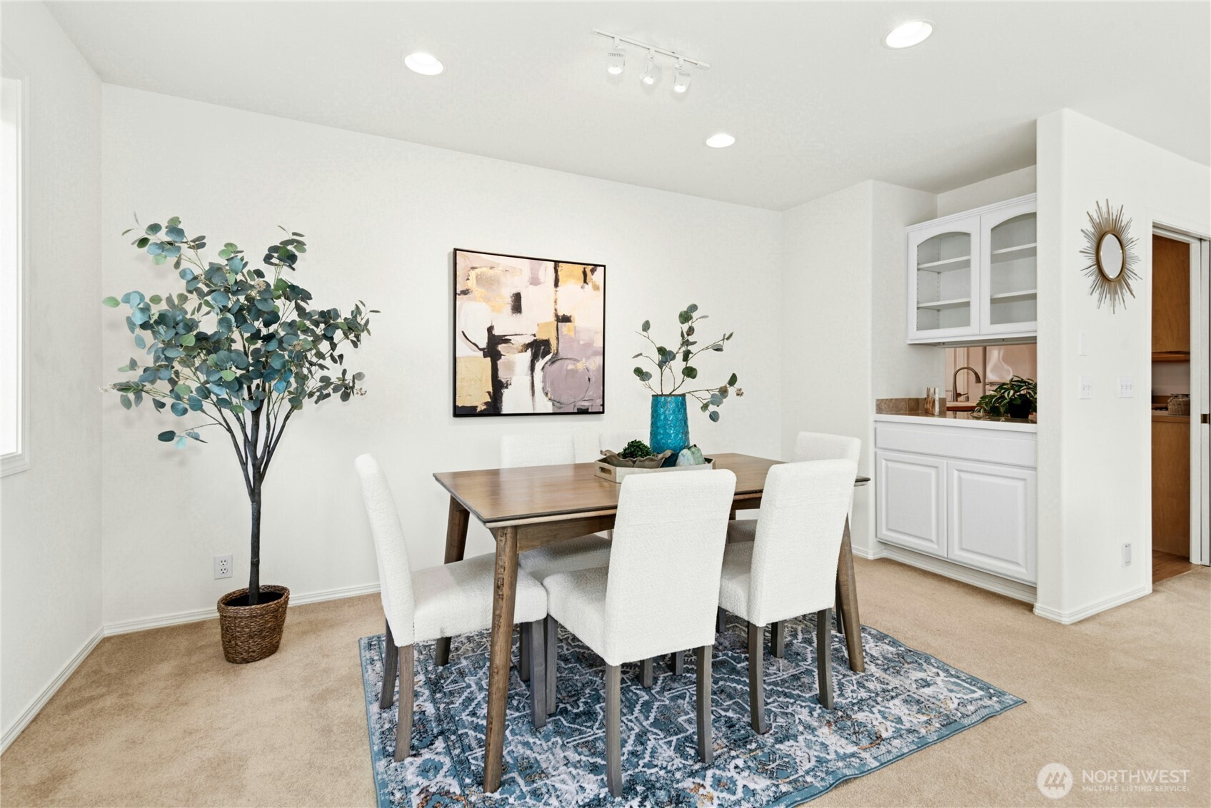 23621 7th Avenue West Bothell, WA 98021 - Photo 7 of 33 a view of a dining room with furniture and a potted plant