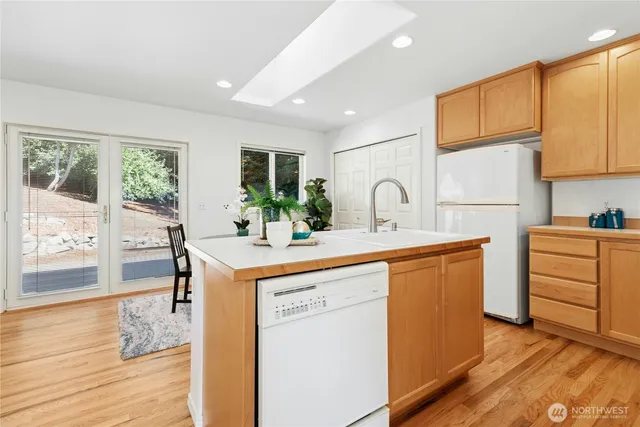 a kitchen that has a sink and a stove in it