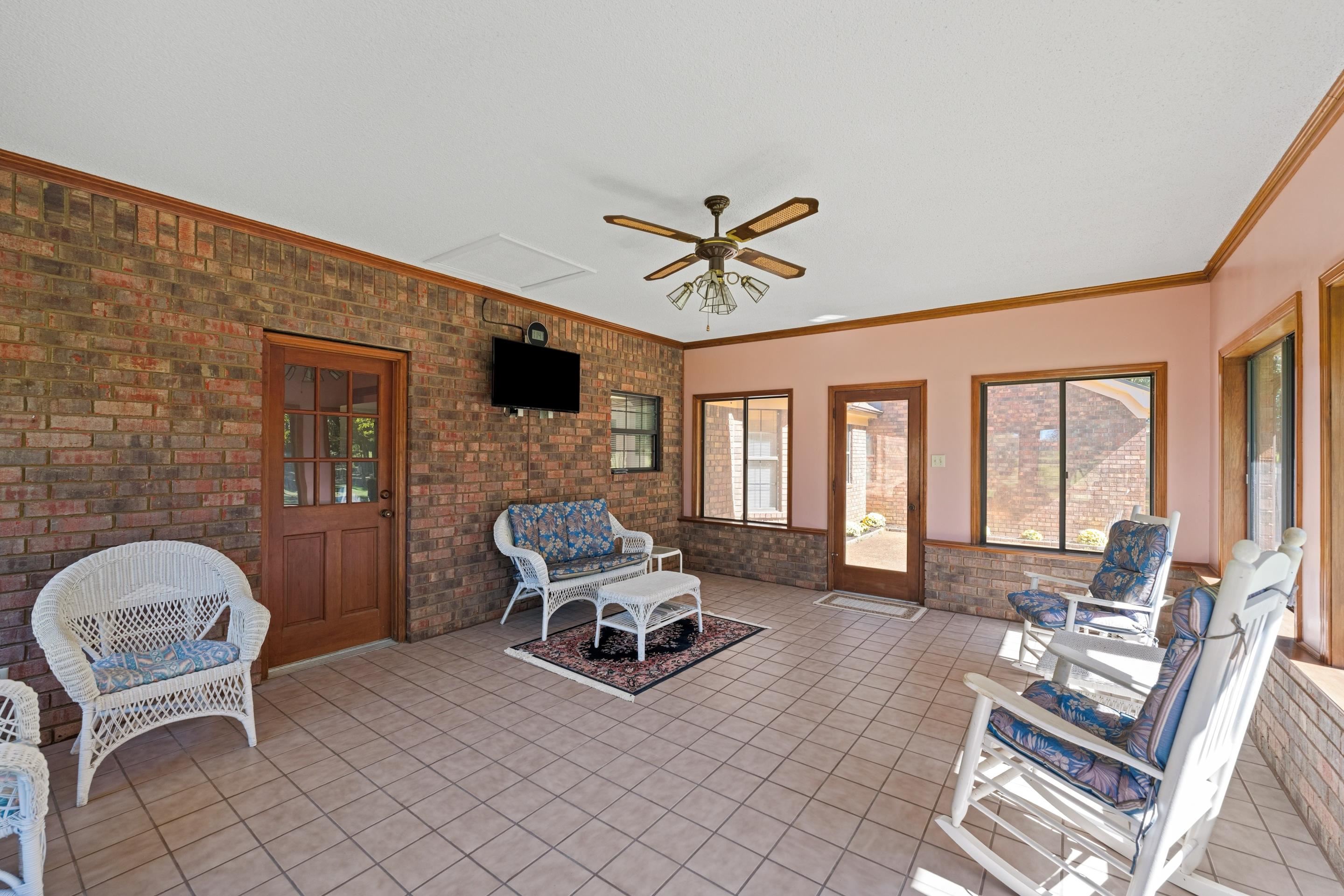 650 Blain Road Rossville, TN 38066 - Photo 14 of 32 Spacious tiled sunroom offering panoramic views of the surrounding countryside—the perfect place to enjoy morning coffee or unwind while taking in peaceful sunsets.