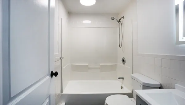 a bathroom with a tub and shower