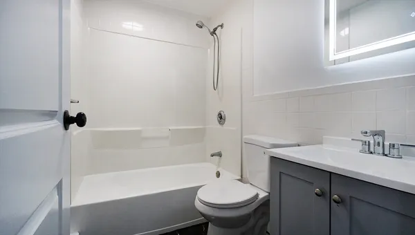 a bathroom with a sink toilet and shower