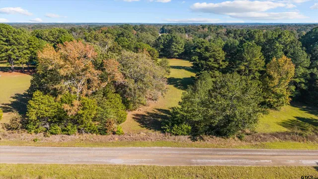 a view of a yard with an outdoor seating
