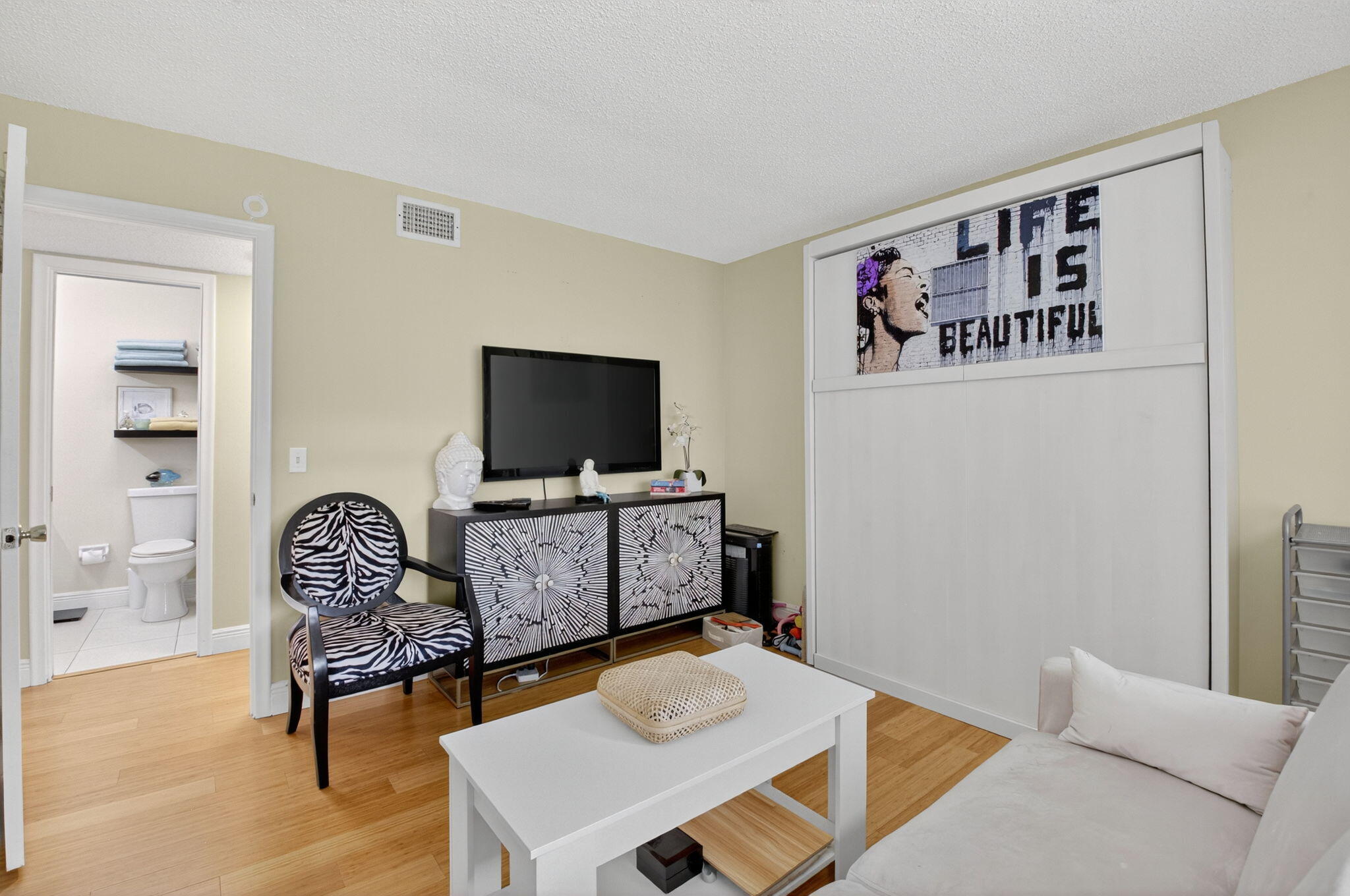 762 High Point Boulevard North, Unit D Delray Beach, FL 33445 - Photo 18 of 32 a living room with furniture and a flat screen tv