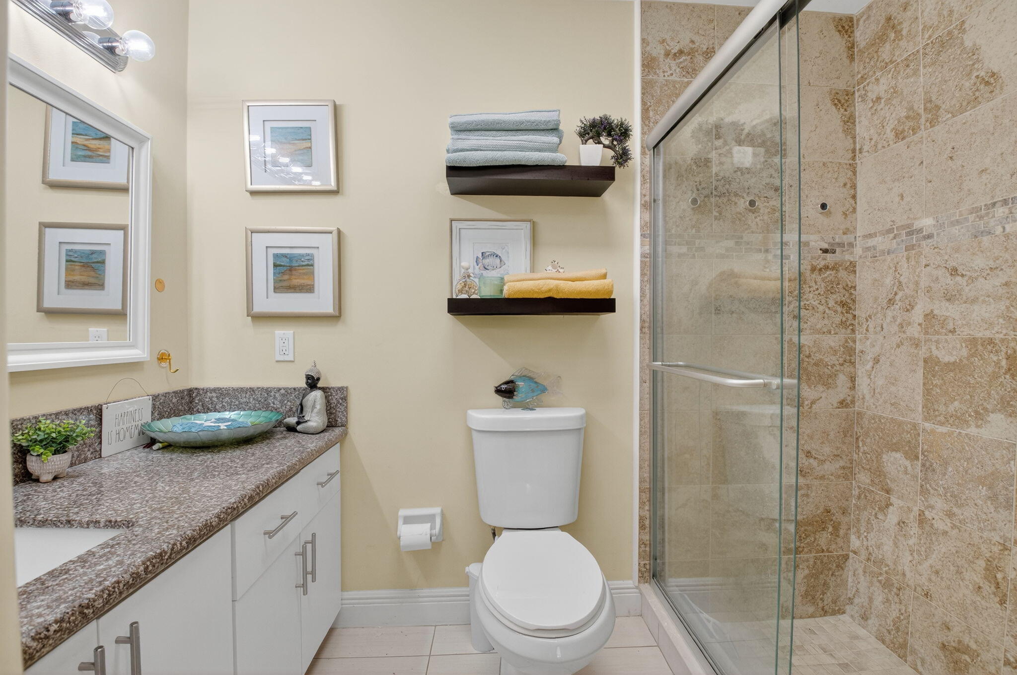762 High Point Boulevard North, Unit D Delray Beach, FL 33445 - Photo 20 of 32 a bathroom with a granite countertop sink a toilet and shower
