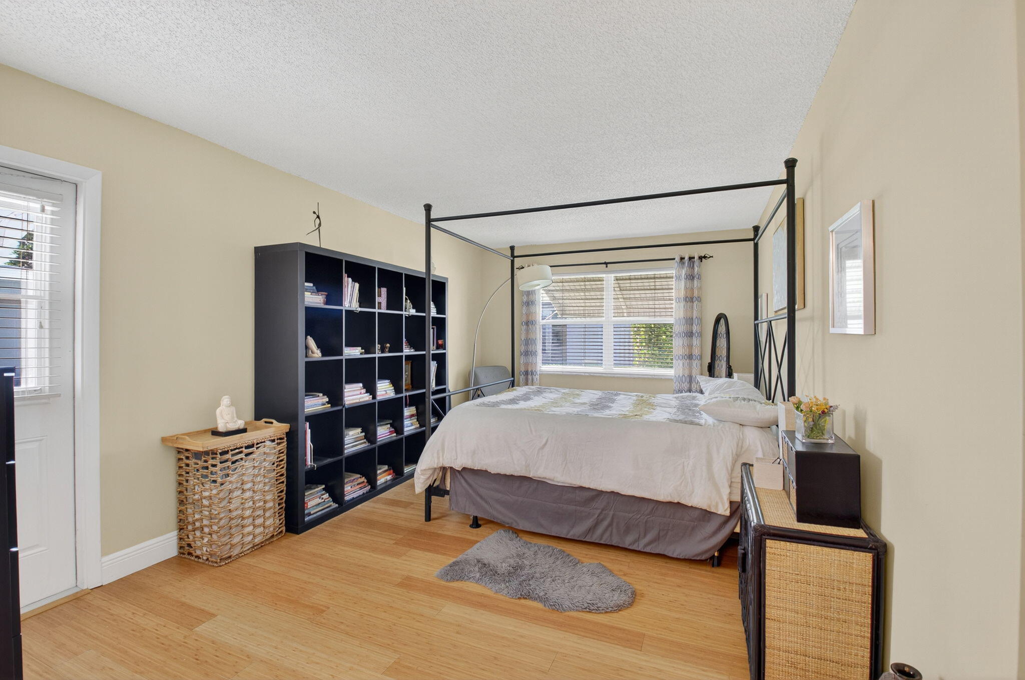 762 High Point Boulevard North, Unit D Delray Beach, FL 33445 - Photo 21 of 32 a bed sitting in a bedroom next to a window