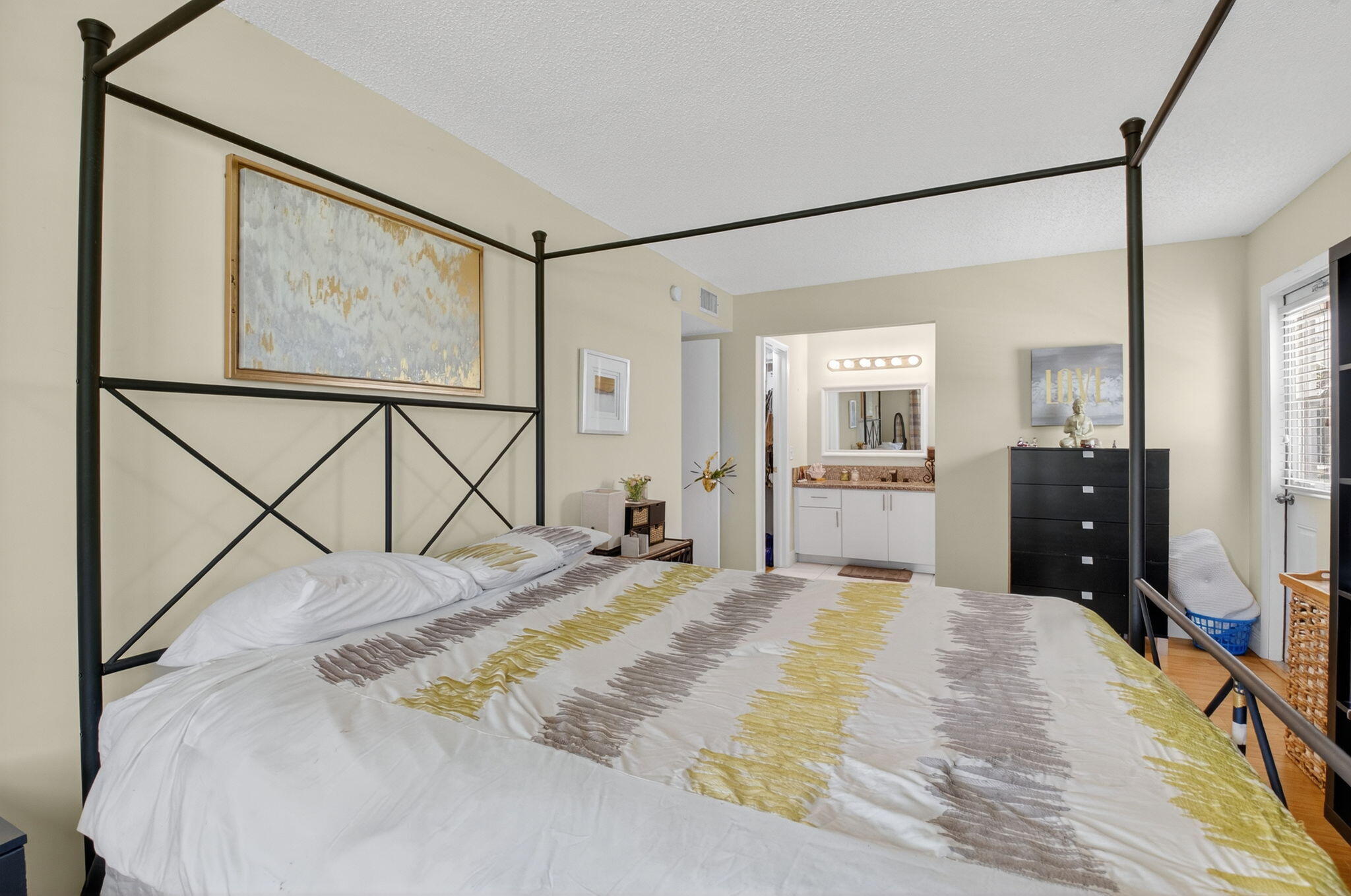 762 High Point Boulevard North, Unit D Delray Beach, FL 33445 - Photo 23 of 32 a bedroom with a bed and wooden floor