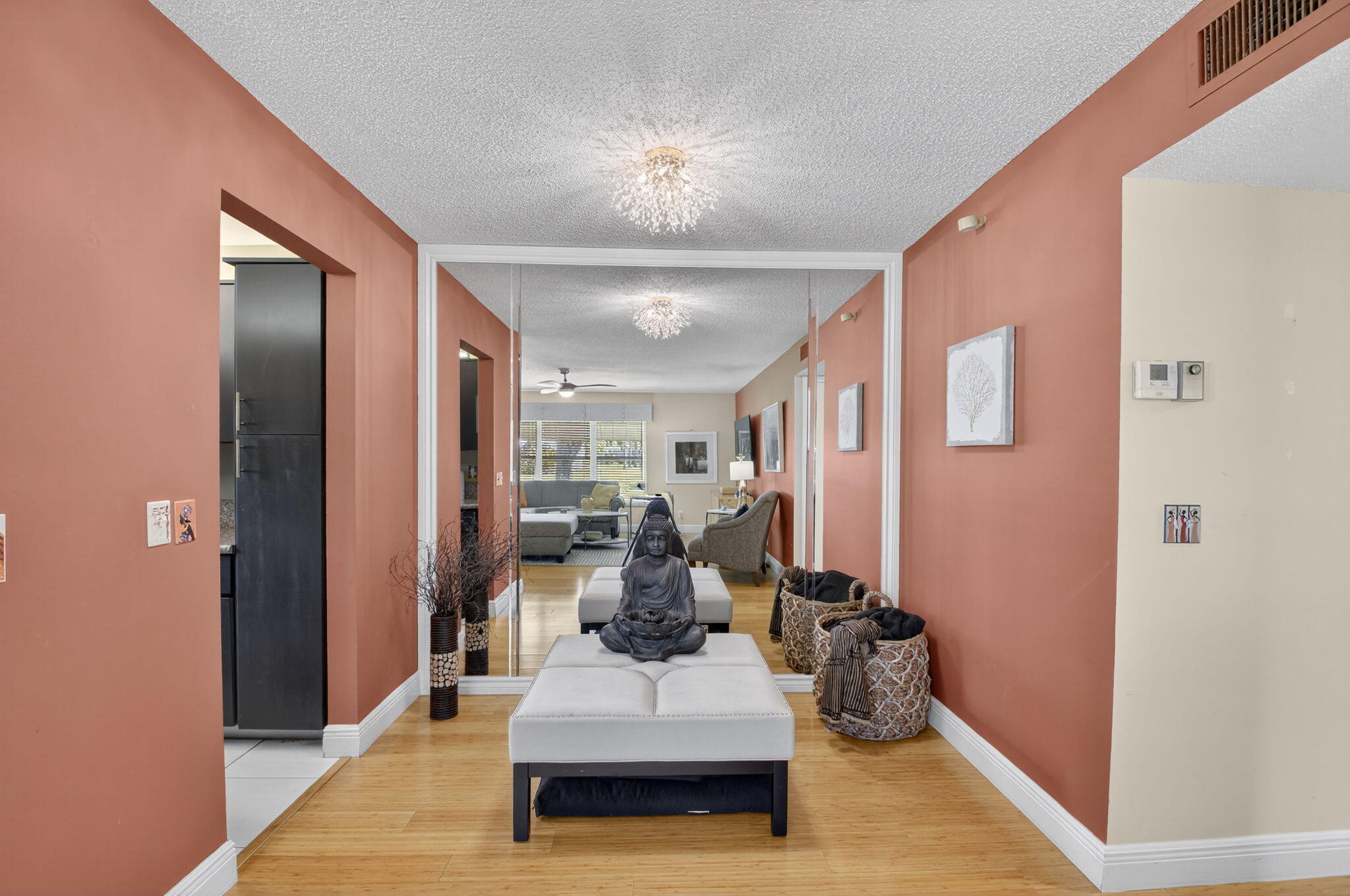 762 High Point Boulevard North, Unit D Delray Beach, FL 33445 - Photo 10 of 32 a living room with furniture and a chandelier