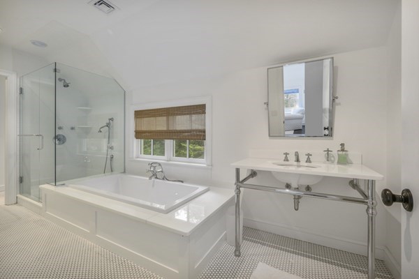 50 Nickerson Drive Barnstable, MA 02635 - Photo 17 of 36 a bathroom with a bathtub a sink a mirror and a shower