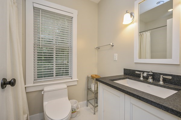 50 Nickerson Drive Barnstable, MA 02635 - Photo 21 of 36 a bathroom with a granite countertop sink toilet and mirror
