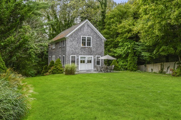 50 Nickerson Drive Barnstable, MA 02635 - Photo 24 of 36 a front view of a house with a garden
