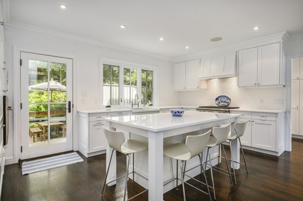 50 Nickerson Drive Barnstable, MA 02635 - Photo 3 of 36 a kitchen with granite countertop white cabinets and chairs
