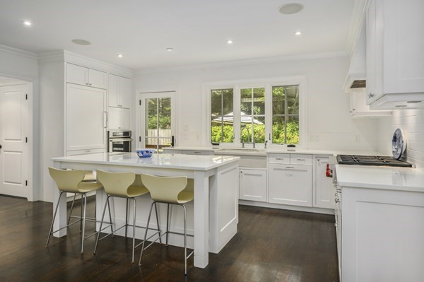 50 Nickerson Drive Barnstable, MA 02635 - Photo 4 of 36 a kitchen with a white cabinets and chairs