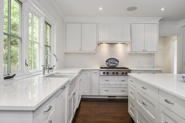 50 Nickerson Drive Barnstable, MA 02635 - Photo 5 of 36 a kitchen with granite countertop white cabinets and a sink