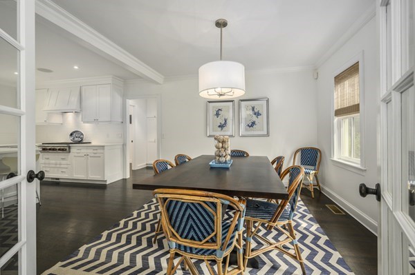 50 Nickerson Drive Barnstable, MA 02635 - Photo 8 of 36 a view of a dining room and livingroom with furniture wooden floor a chandelier