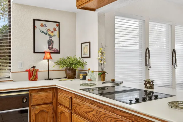 a kitchen with cabinets and window