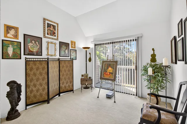 a bedroom with furniture and a chandelier